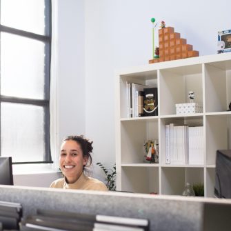 Woman at office desk smiling